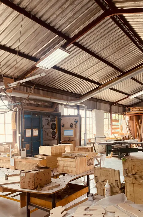 A woodworking workshop with benches and timber
